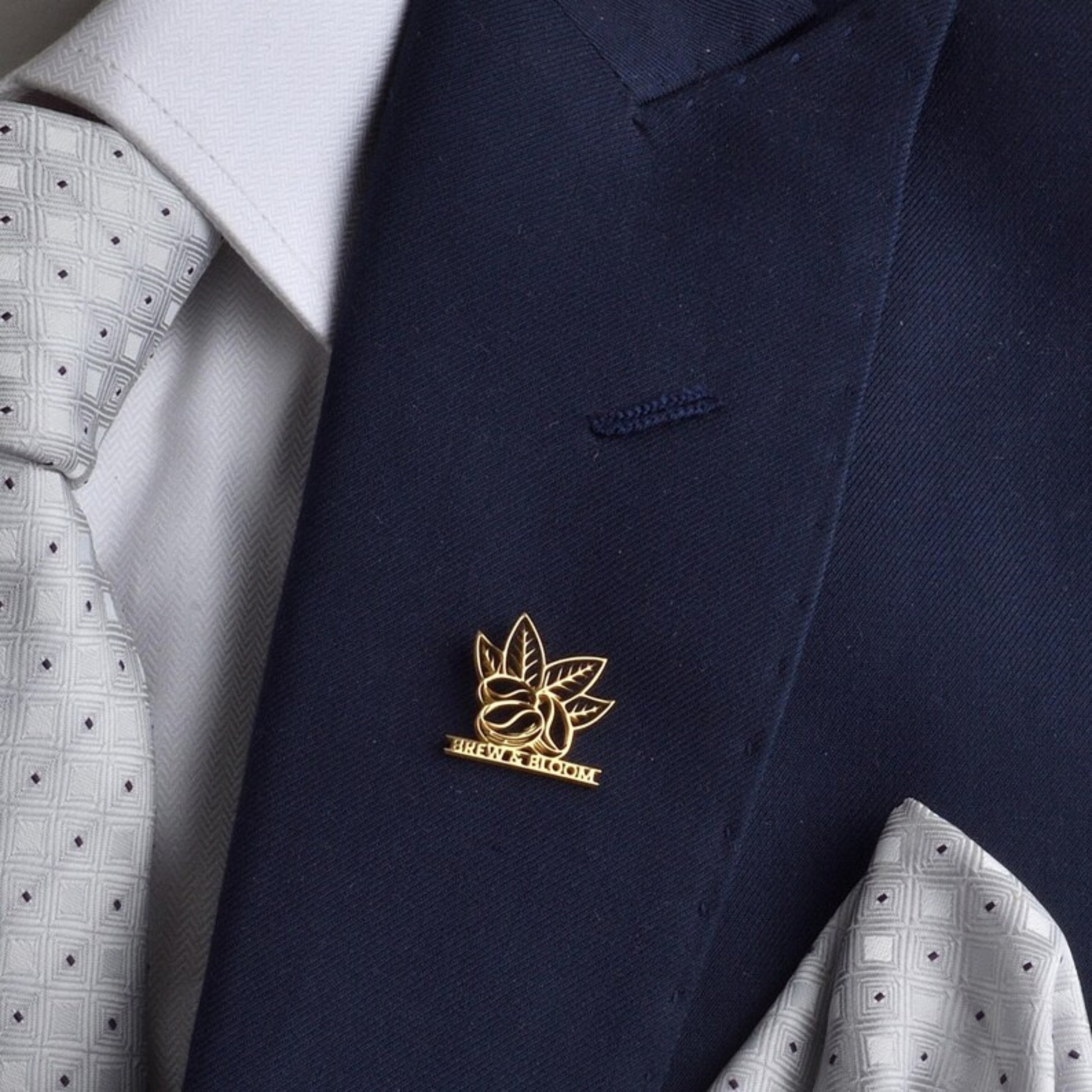 Corporate logo brooch pin on white shirt collar
